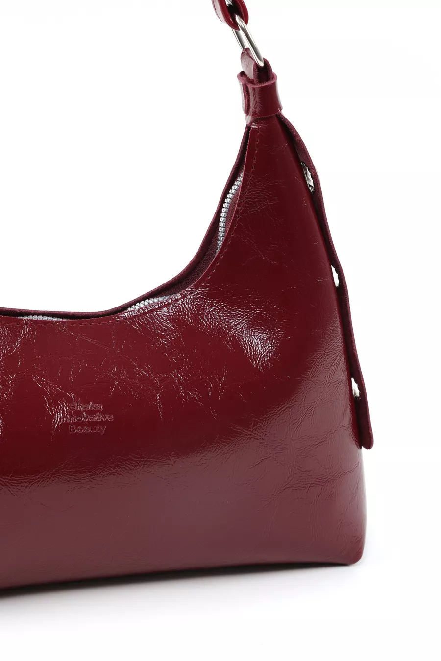 Sac à main et à épaule pour femme en cuir synthétique bordeaux à texture froissée, modèle , à un compartiment, forme baguette