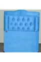 Tête de lit simple en tissu matelassé turquoise avec motif plume de poulain