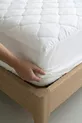 Protège-matelas en coton matelassé avec bord complet, blanc